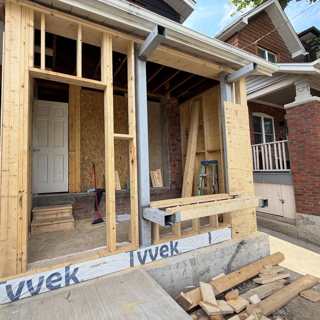 Front-wall wood framing with steel supports during a house remodel