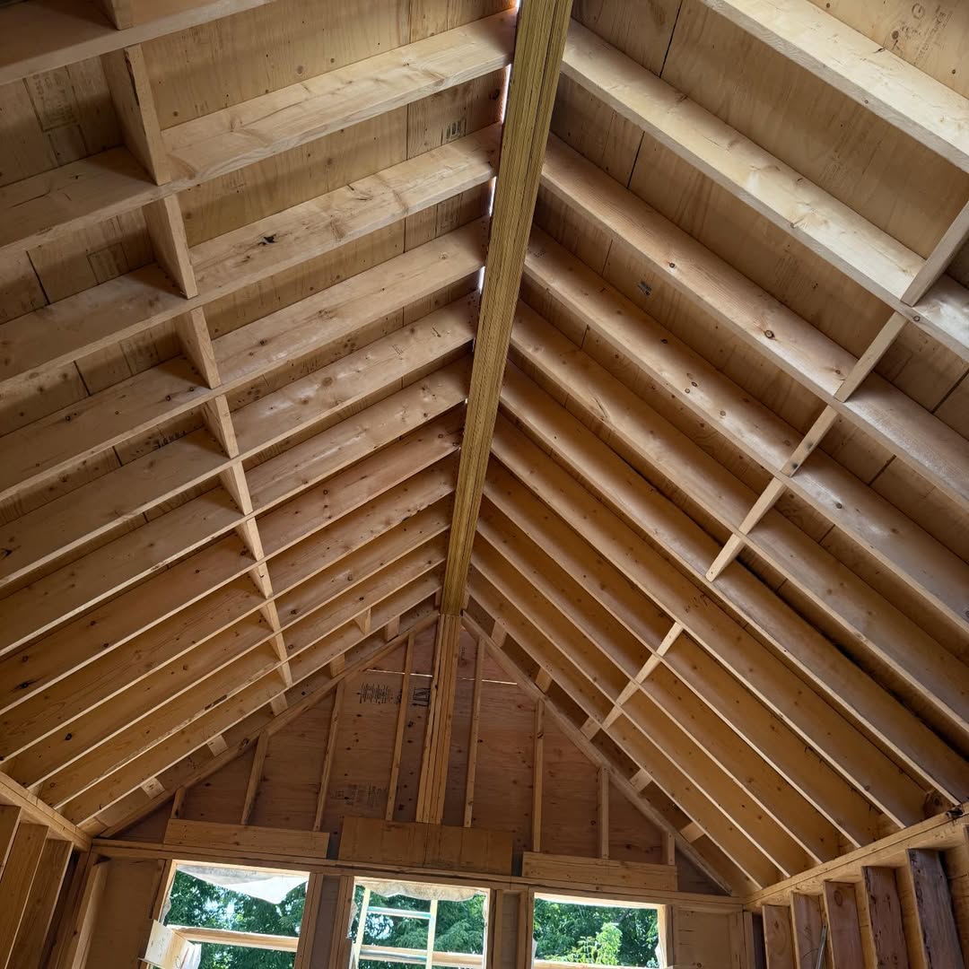 Interior view of roof rafters, sheathing and ridge beam